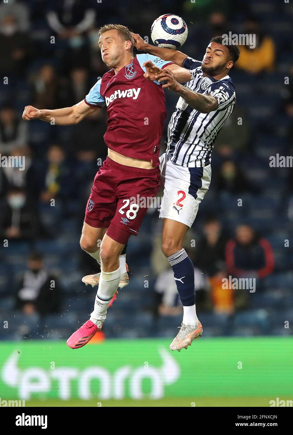 West Ham United's Tomas Soucek (left) and West Bromwich Albion's Darnell Furlong battle for the ball during the Premier League match at The Hawthorns, West Bromwich. Picture date: Wednesday May 19, 2021. Stock Photo