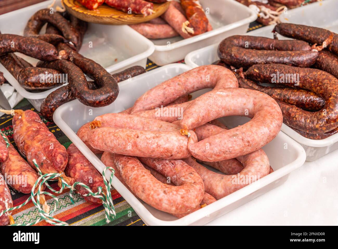 Typical Spanish sausages lying on a village stall at the food market