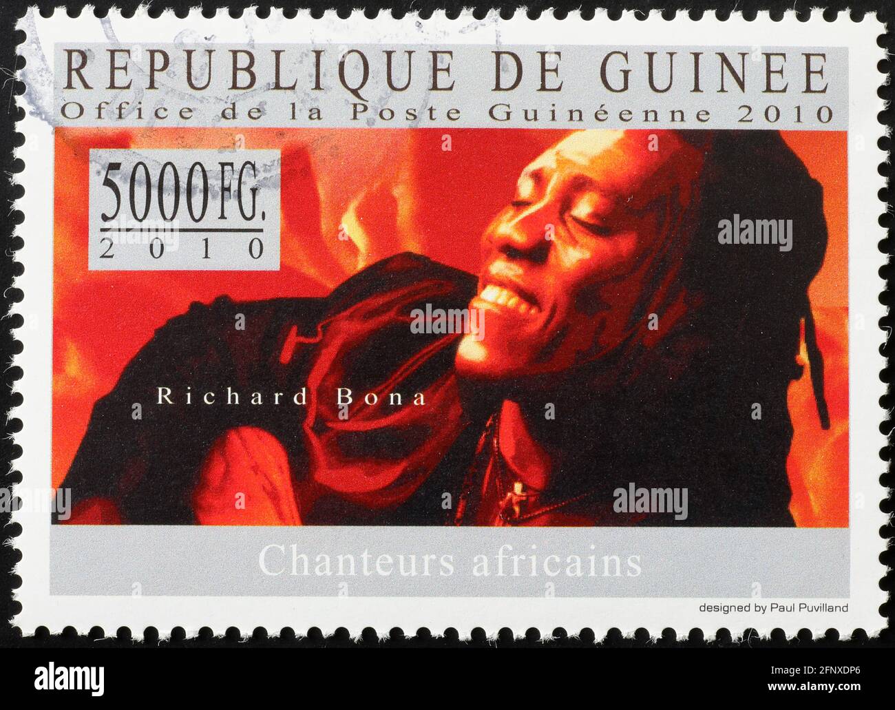 Richard Bona portrait on stamp of Guinea Stock Photo