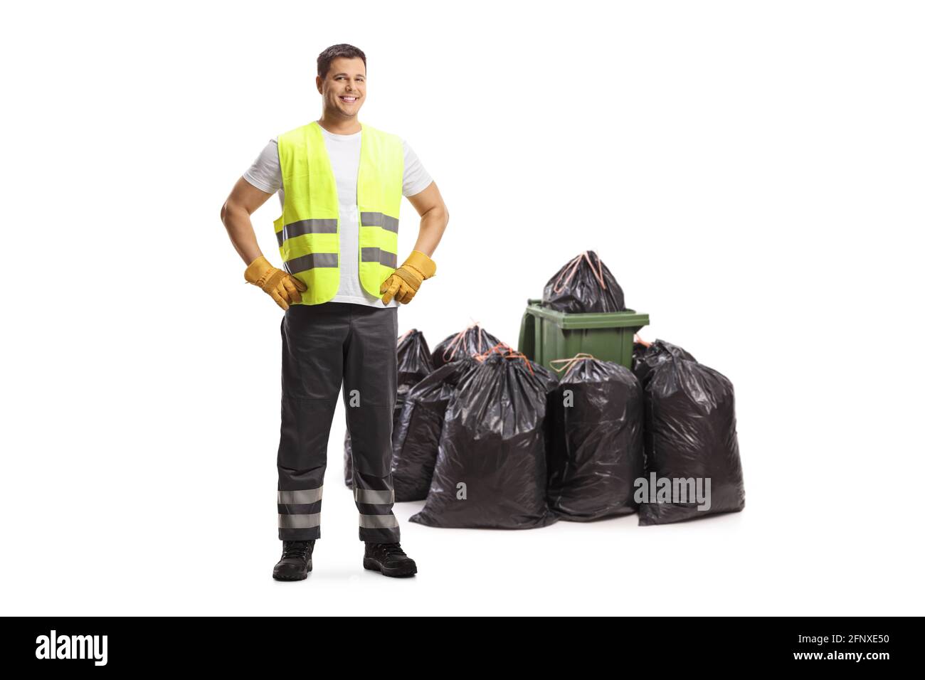 Full length portrait of a waste collector standing in front of bin bags isolated on white background Stock Photo