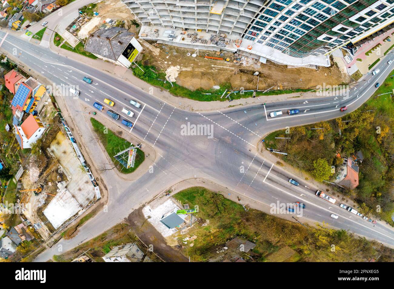 Top down aerial view of busy street intersection with moving cars ...