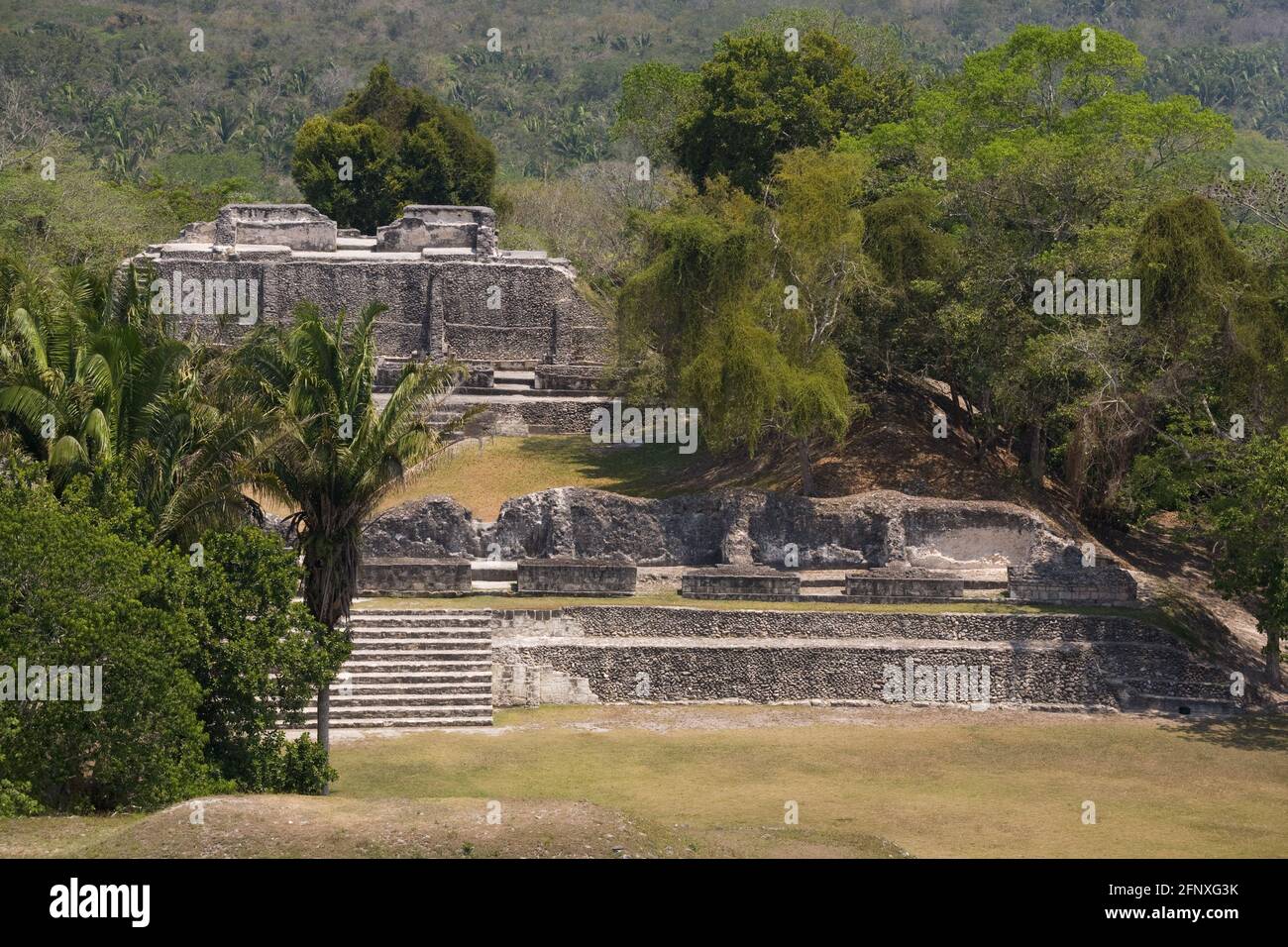 The main plaza seen from El Castillo at the Mayan ruins of Xunantunich. Mayan for The Stone Maiden, or Lady of the Rocks, the Mayan city was named aft Stock Photo