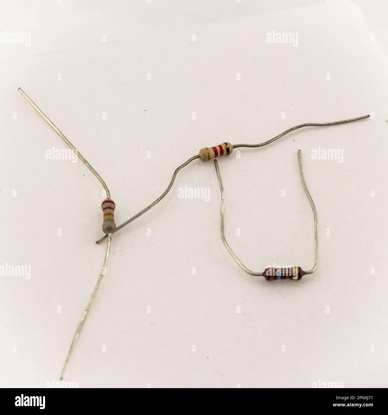 miniature resistors on white background. Passive two terminal