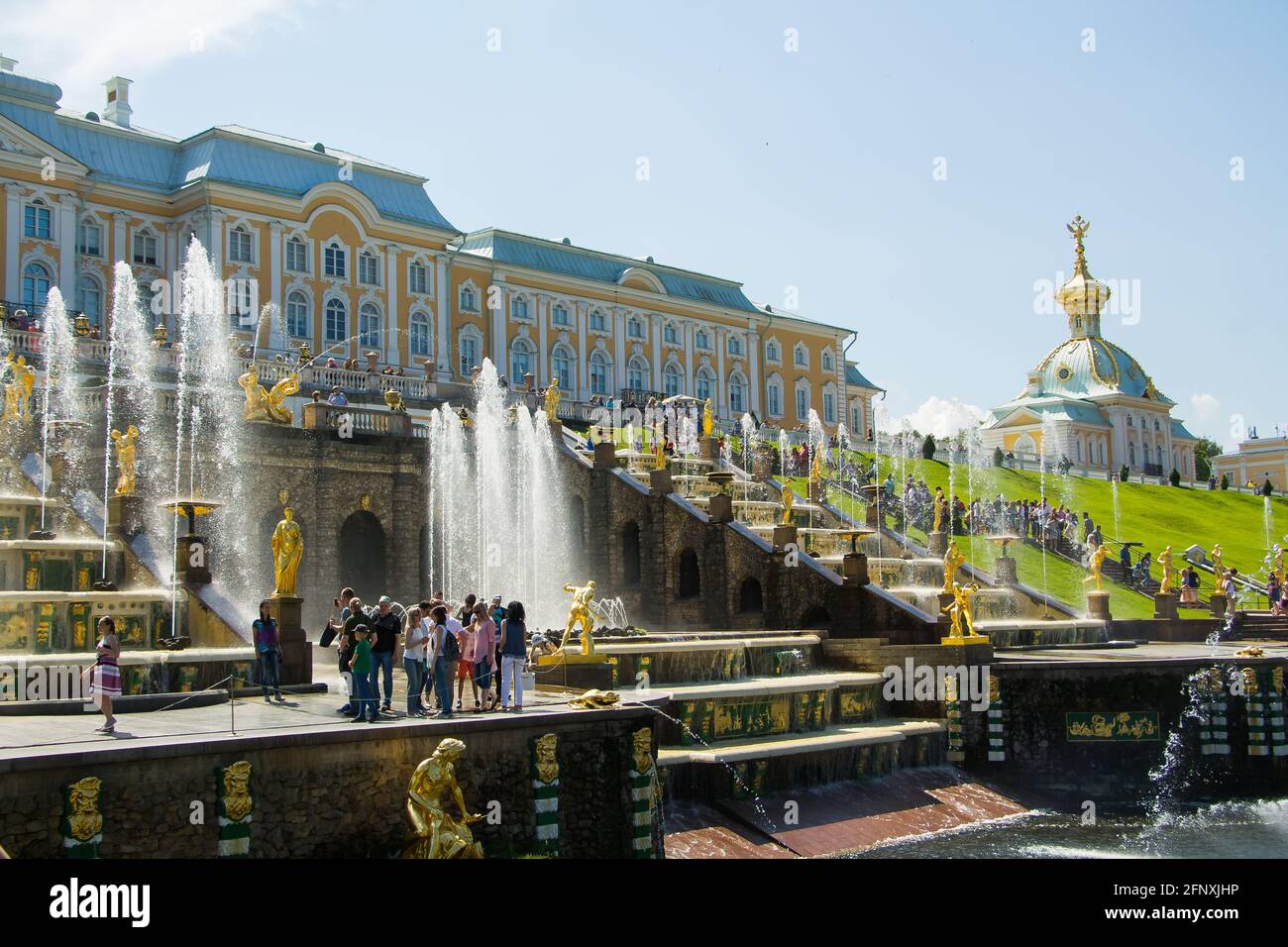 Peterhof, Russia: July 16, 2016 - the palace park. Celebration of the opening of the fountains. Tourists visiting the landmark of St. Petersburg. Stock Photo