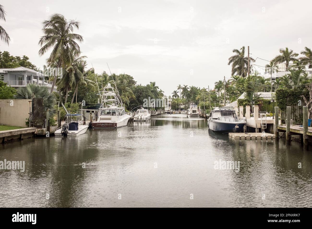 Luxury power boats at their private moorings outside luxury waterfront