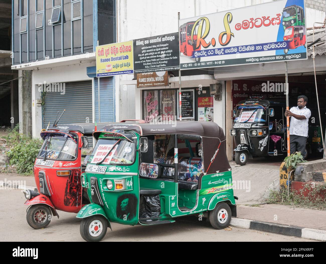 New auto rickshaws for sale outside dealership, Anuradhapura, Sri Lanka Stock Photo