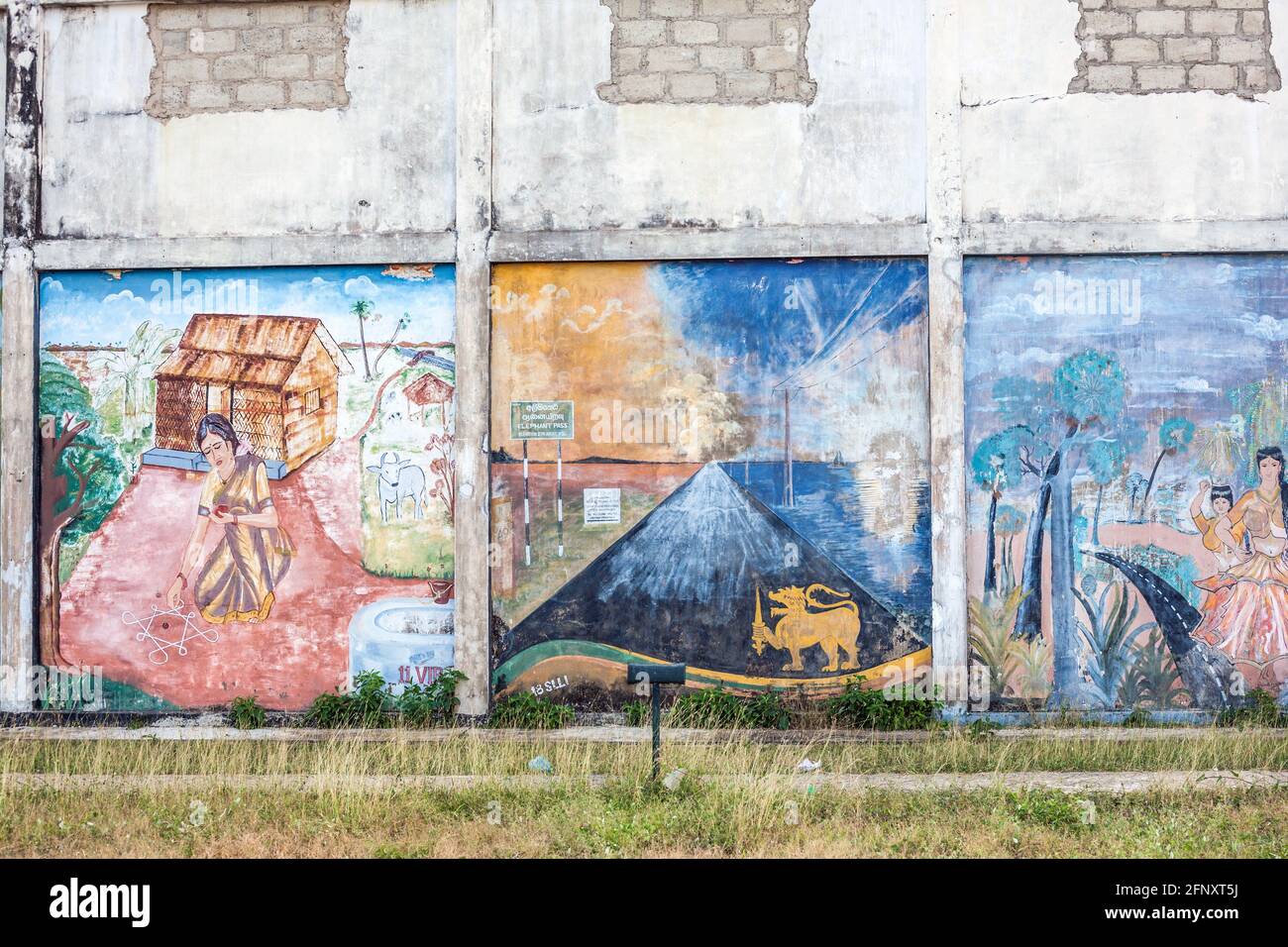 Artwork left over from the civil war on a wall by the beach in Kankesanturai, Northern Province, Sri Lanka Stock Photo