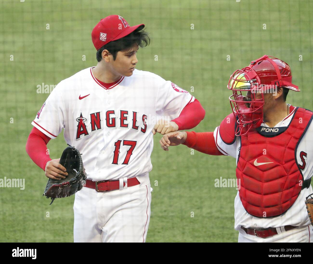 Los Angeles Angels pitcher Shohei Ohtani (17) walks to the dugout with  catcher Kurt Suzuki after ending the top of the fourth inning against the  Cleveland Indians at Angel Stadium in Anaheim