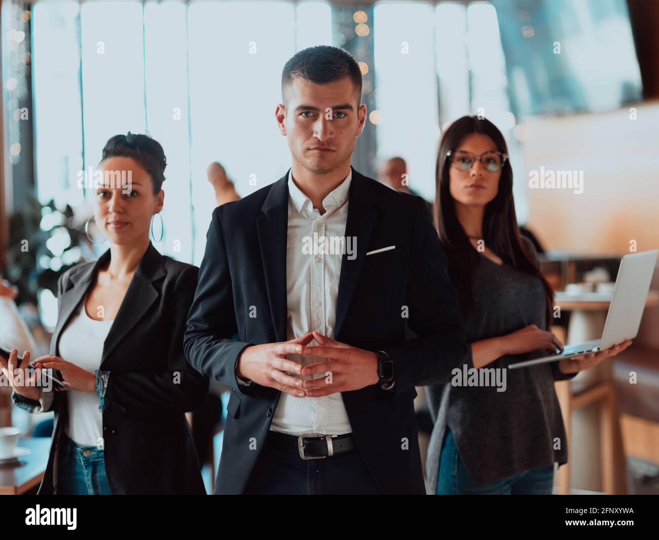 Group of successful business people standing together at office Stock ...