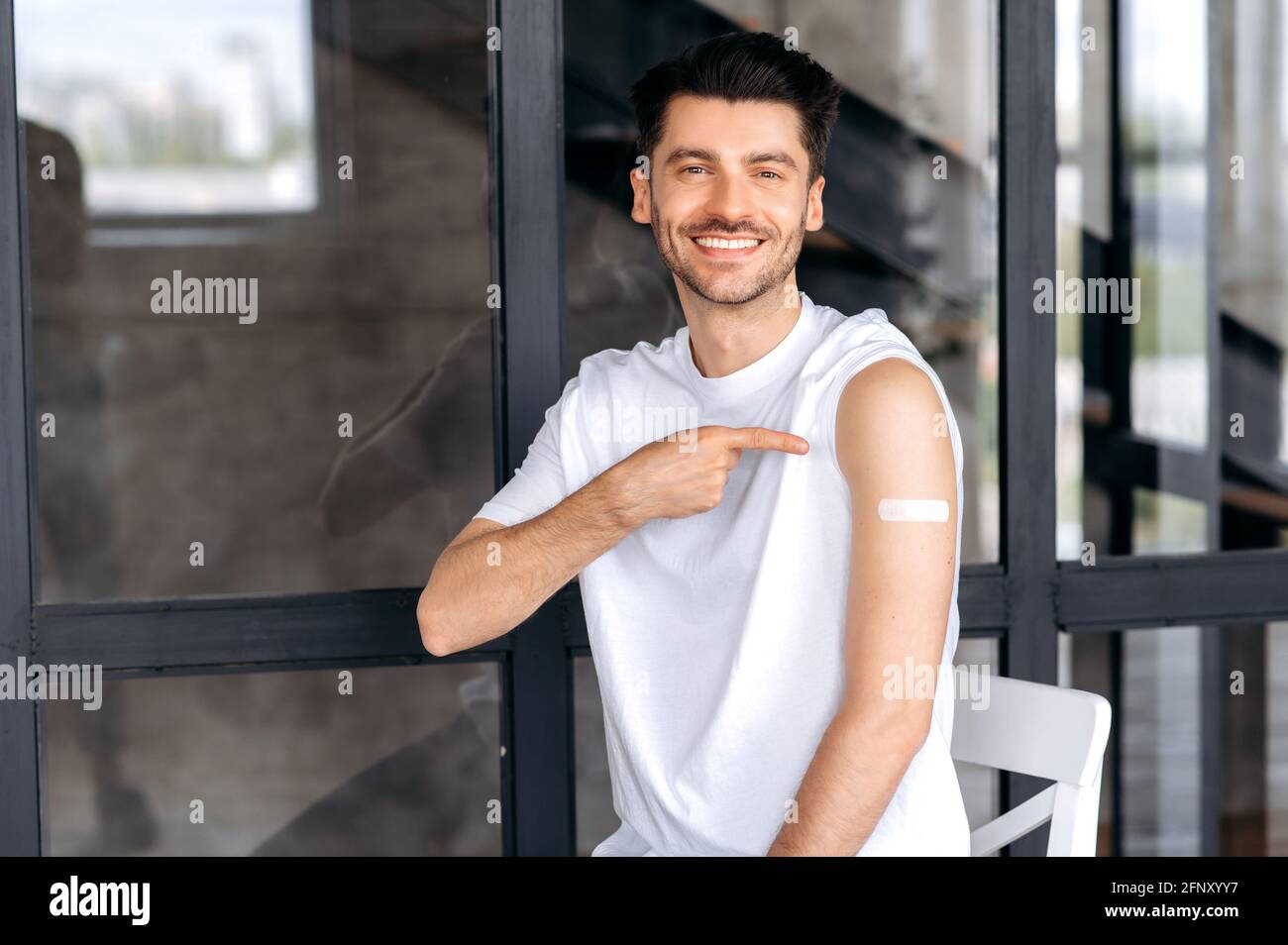 Vaccination and immunity concept. Happy healthy caucasian male received the covid19 vaccine, immunity of viruses and infections. Healthcare and medicine Stock Photo