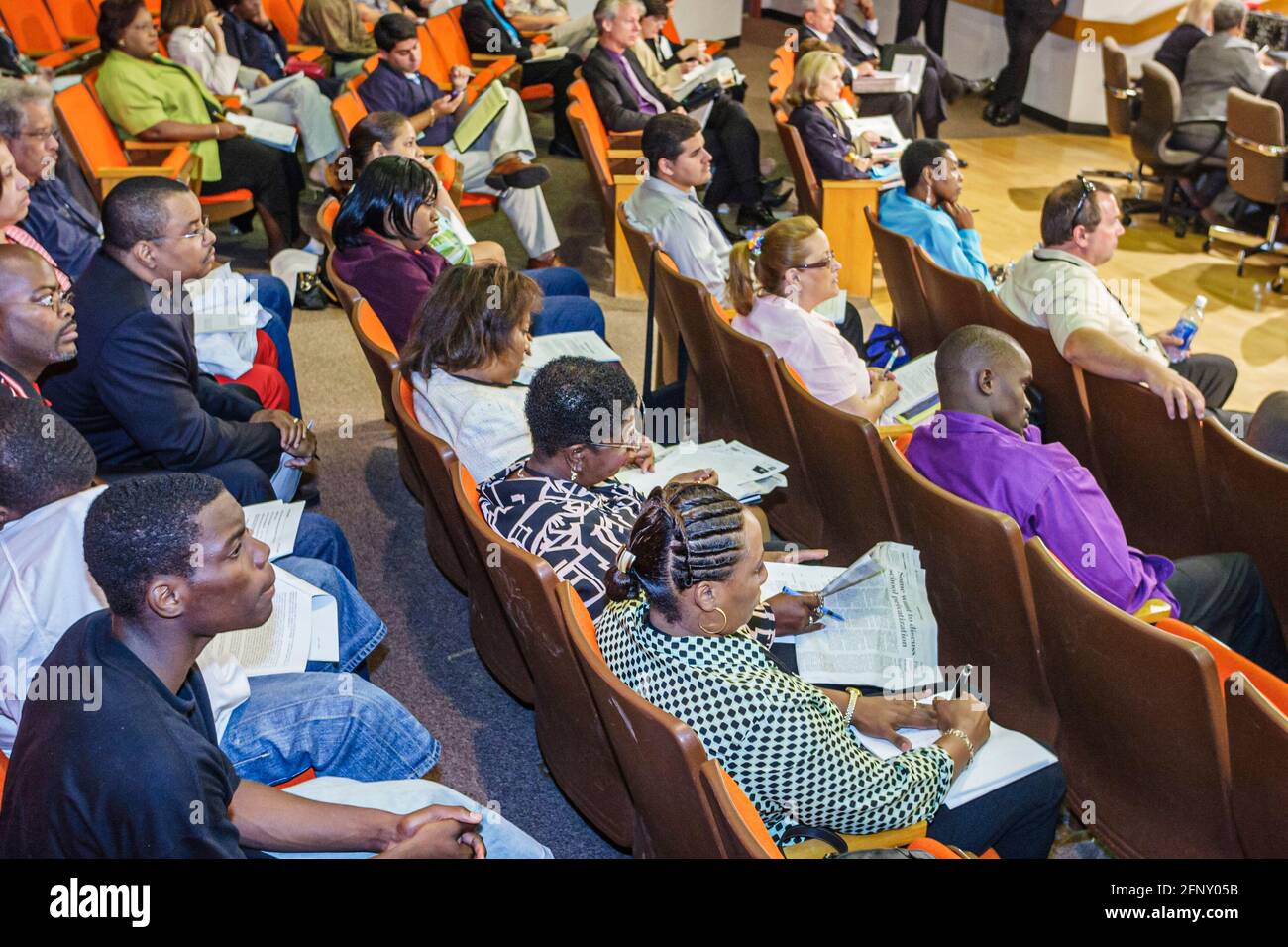 Miami Florida,Board of Education meeting,discuss discussing school closings members,Black man men listen listening audience, Stock Photo