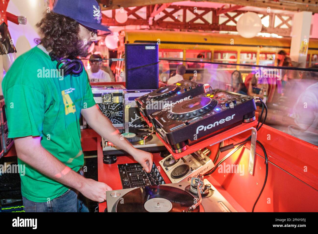 Miami Florida,The Pawn Shop night club night,dee jay dj disc jockey playing music records dance,sound system man male, Stock Photo