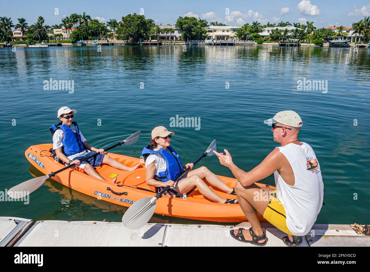 Miami Beach Florida,Indian Creek Rowing Club,instructor instructing guide mother son rental kayak, Stock Photo