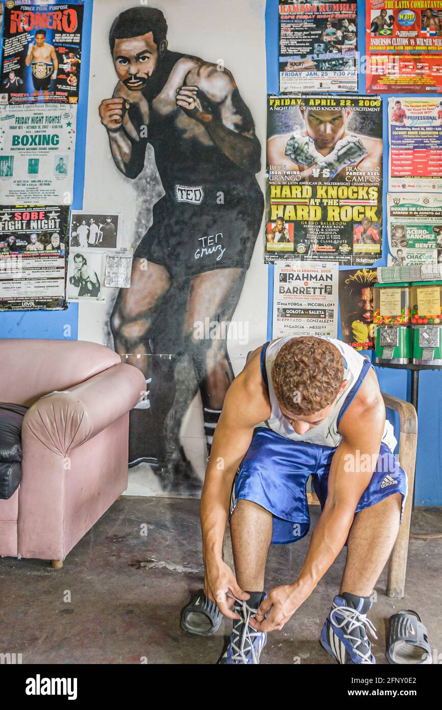 Miami Florida,Allapattah Little Dominican Republic,Teo Cruz Boxing Gym Hispanic teen teenage boy male,ties shoes posters, Stock Photo