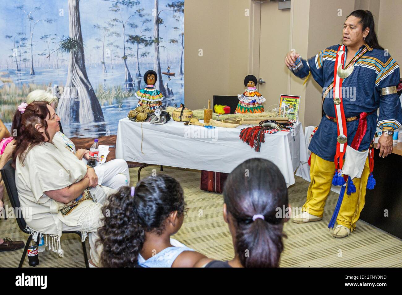 Florida Hollywood Ft. Fort Lauderdale,Seminole Hard Rock Casino Hotel & Resort,Native American Okalee Indian Village storyteller storytelling man audi Stock Photo