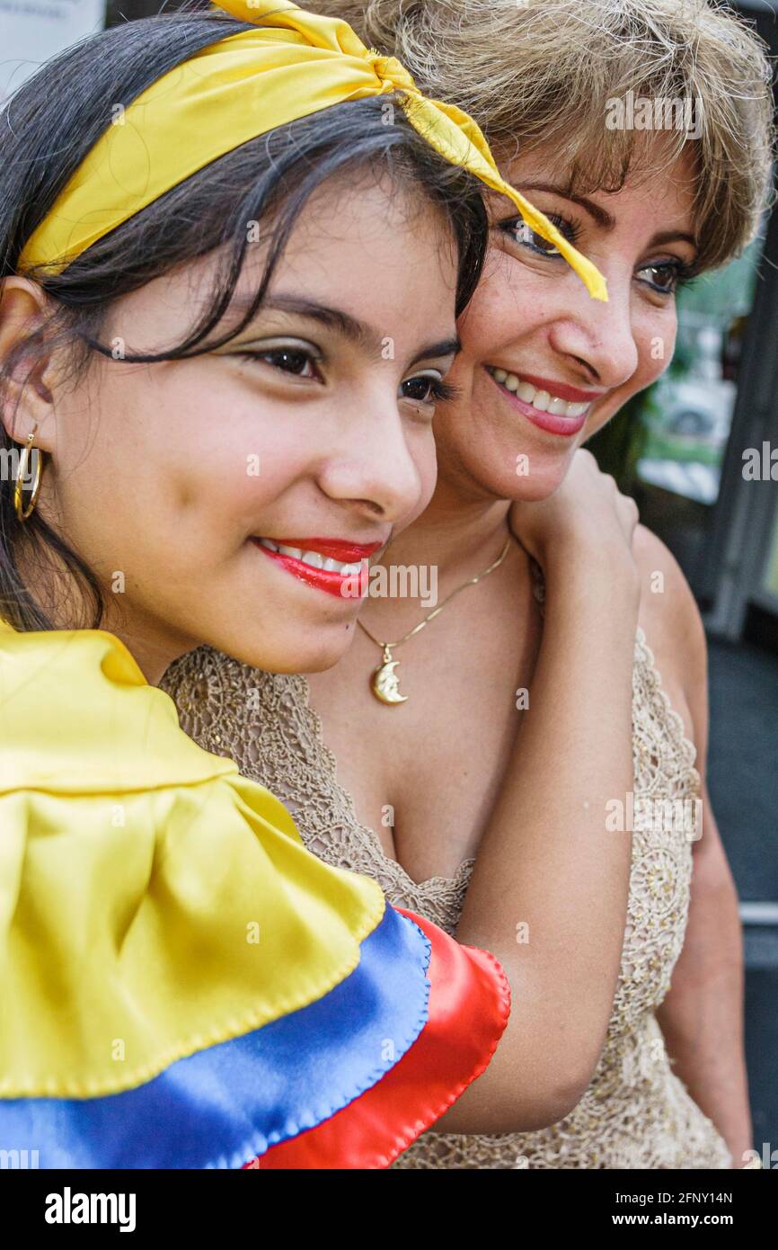 Miami Florida,Dade College Wolfson Miami Book Fair International,Colombia Pavilion Hispanic girl wearing dance outfit hugging mother, Stock Photo