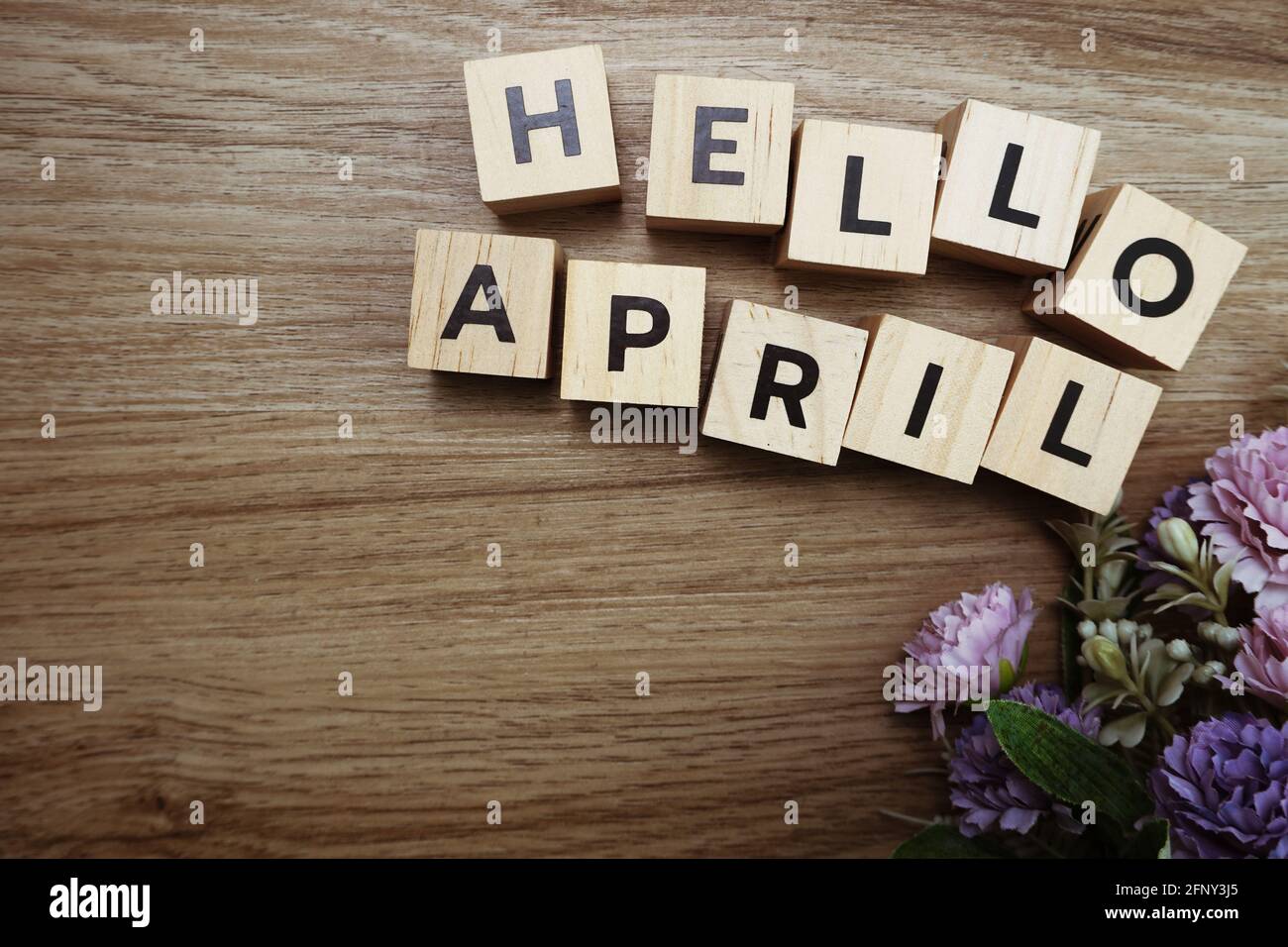 Hello April alphabet letters on wooden background Stock Photo - Alamy
