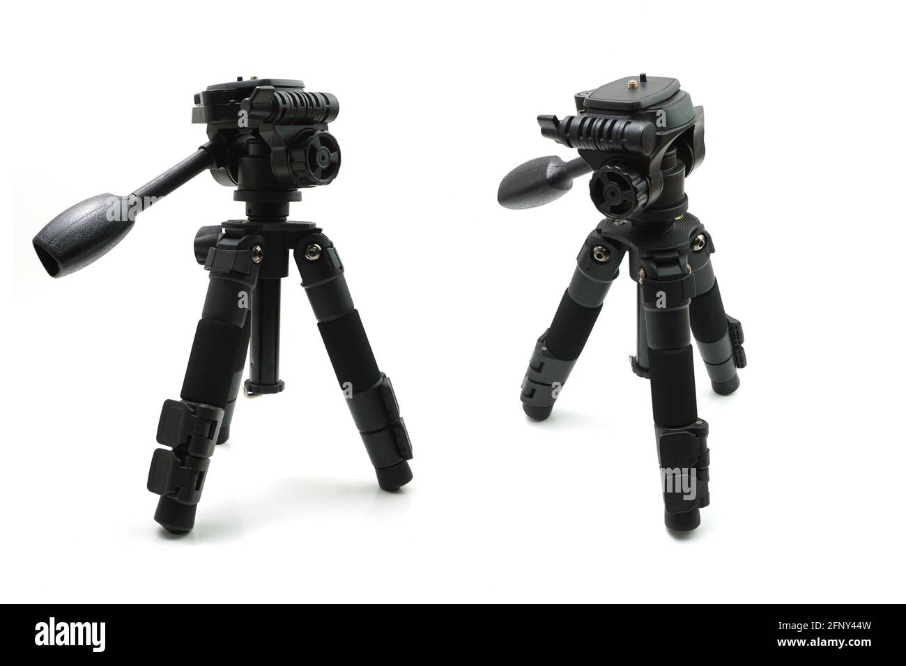 Tripod camera isolated on white background Stock Photo - Alamy
