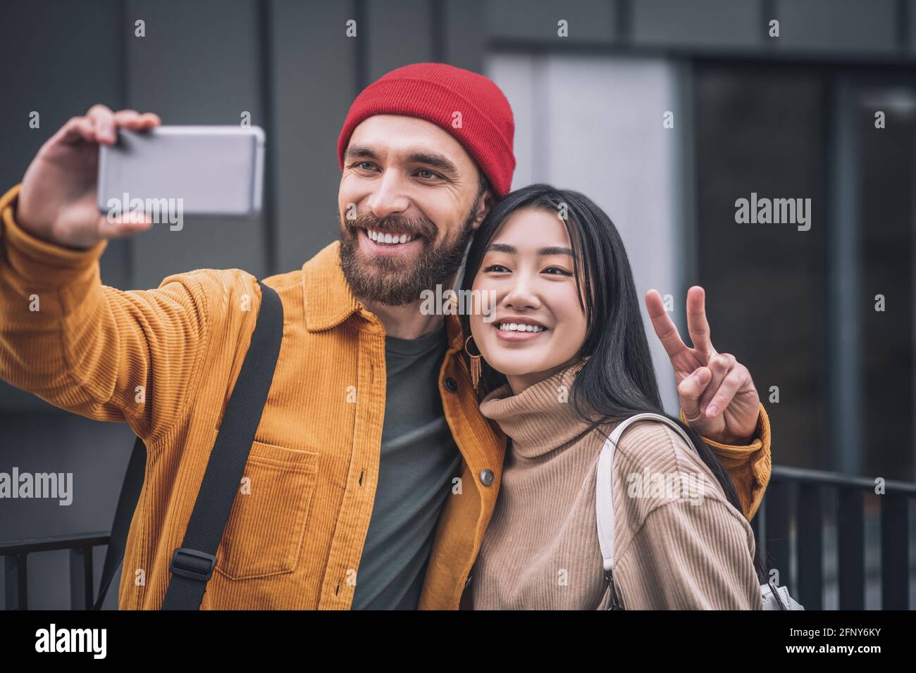 Positive man woman making selfie hi-res stock photography and images ...