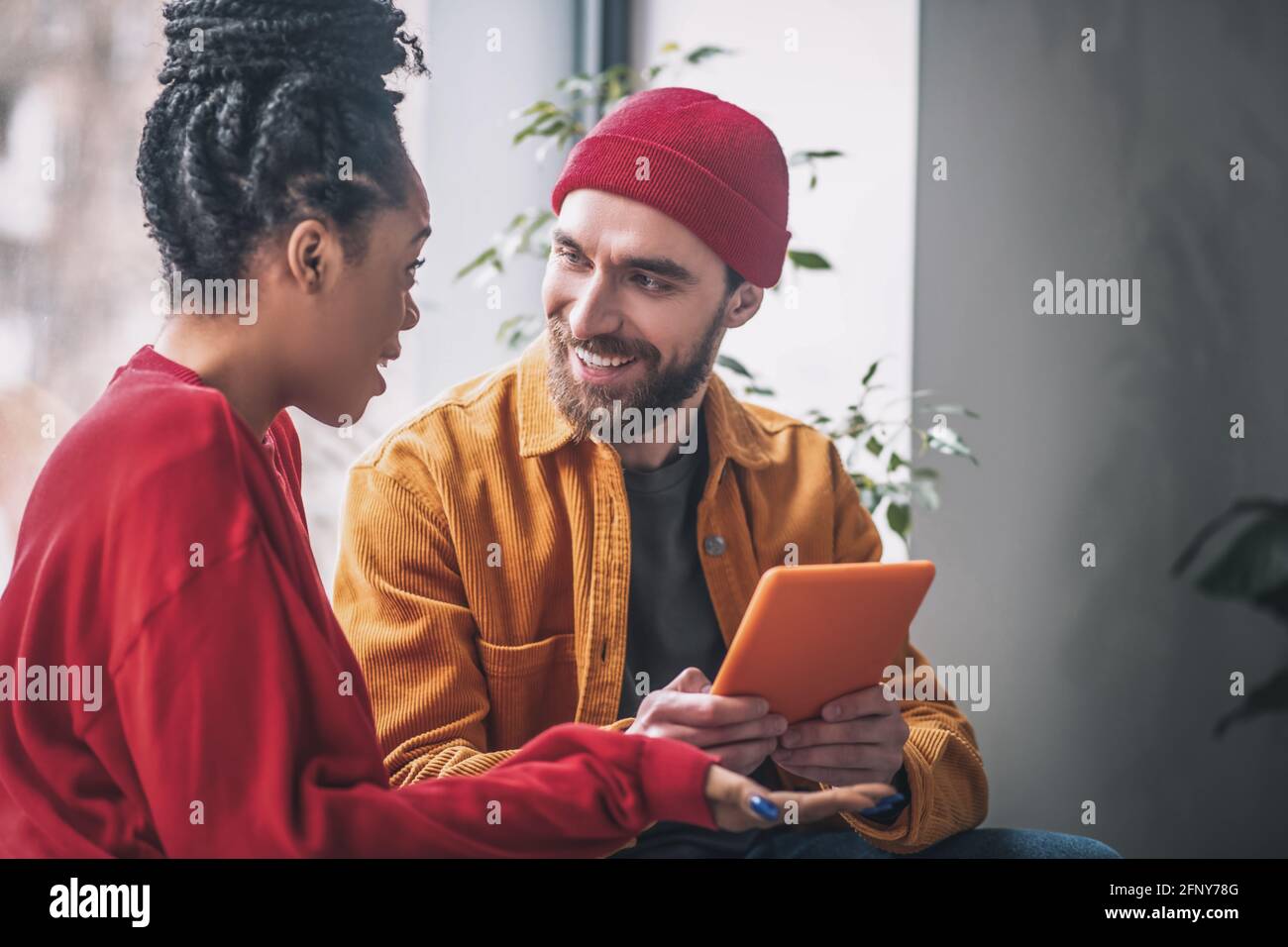Black man talking colleagues on hi-res stock photography and images - Alamy