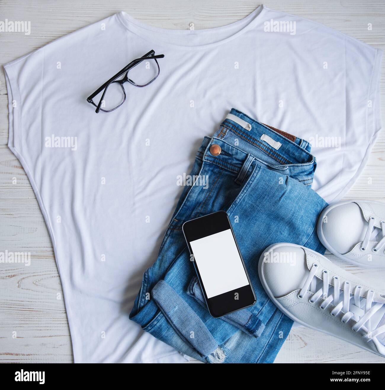 Stylish Female Clothes Set Woman Outfit On Wooden Background Blue Jeans White T Shirt White Sneakers And Sunglasses Flat Lay Top View Stock Photo Alamy