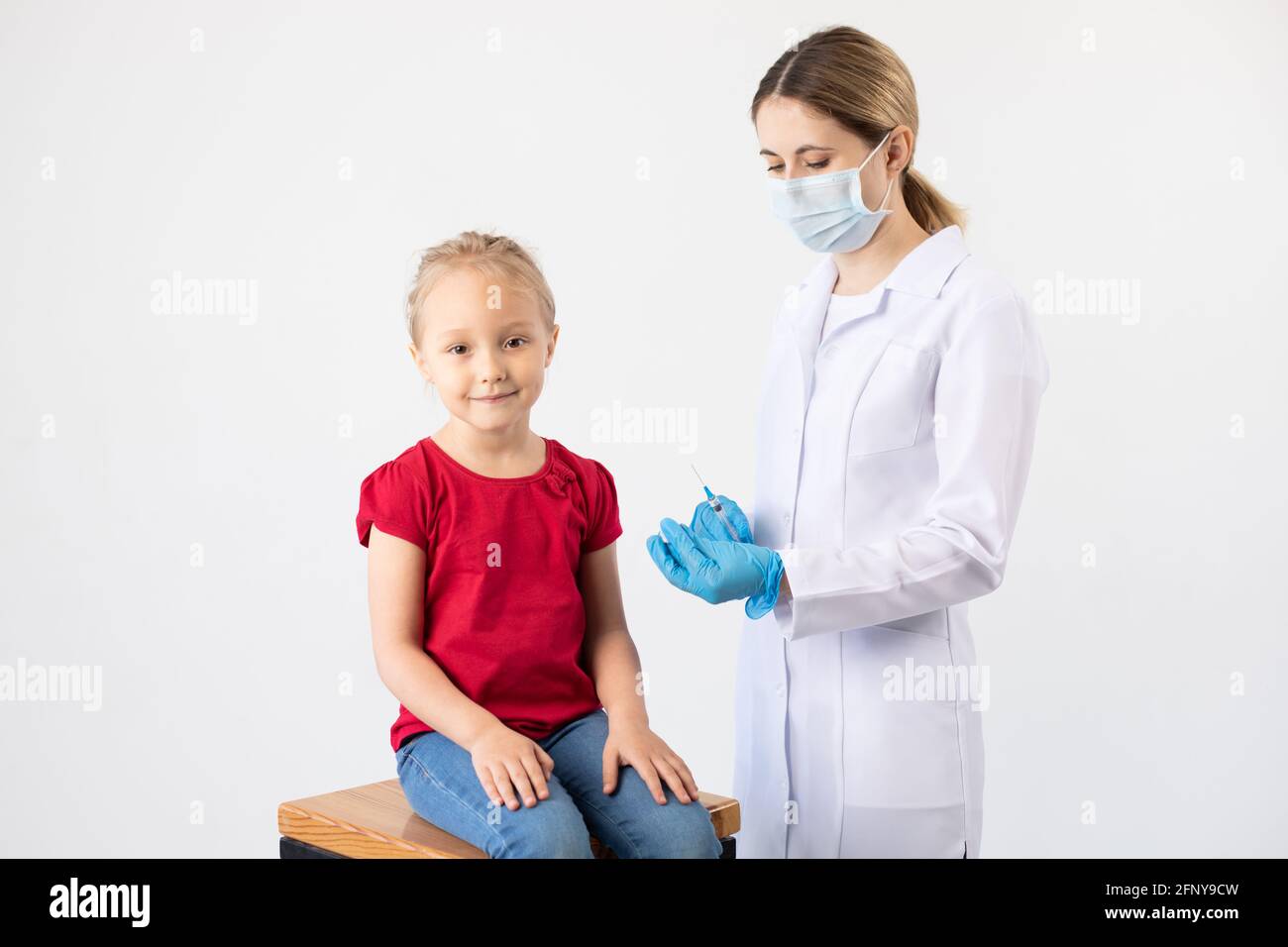 Child Receiving Injection The doctor gives the child an injection of the vaccine Stock Photo - Alamy