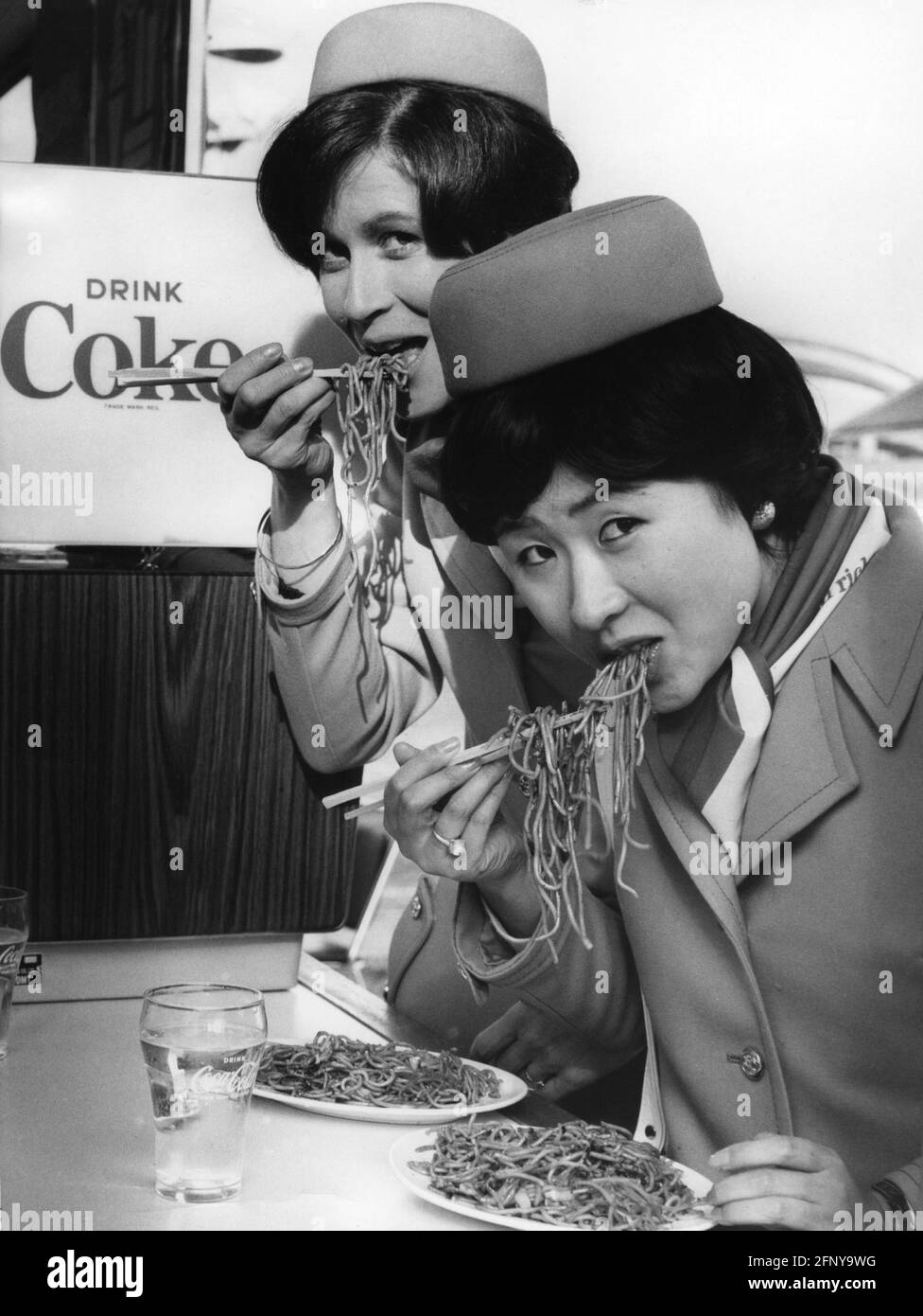 geography / travel, Japan, people, Japanese and German hostess eating fried noodles at Expo 70, ADDITIONAL-RIGHTS-CLEARANCE-INFO-NOT-AVAILABLE Stock Photo