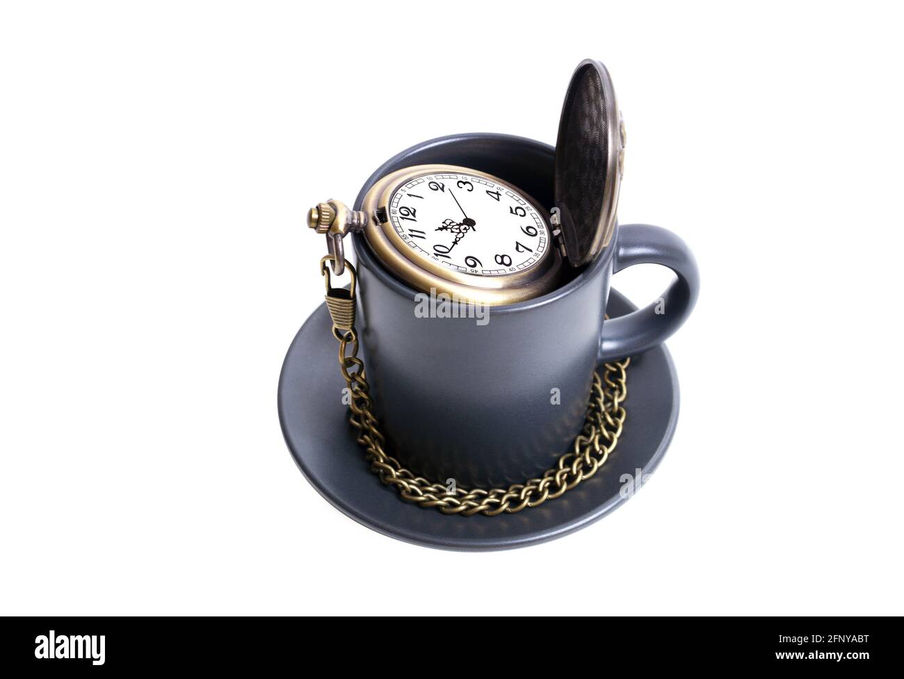 Antique pocket watch with a chain in a coffee cup isolated on white. Coffee time concept. Stock Photo