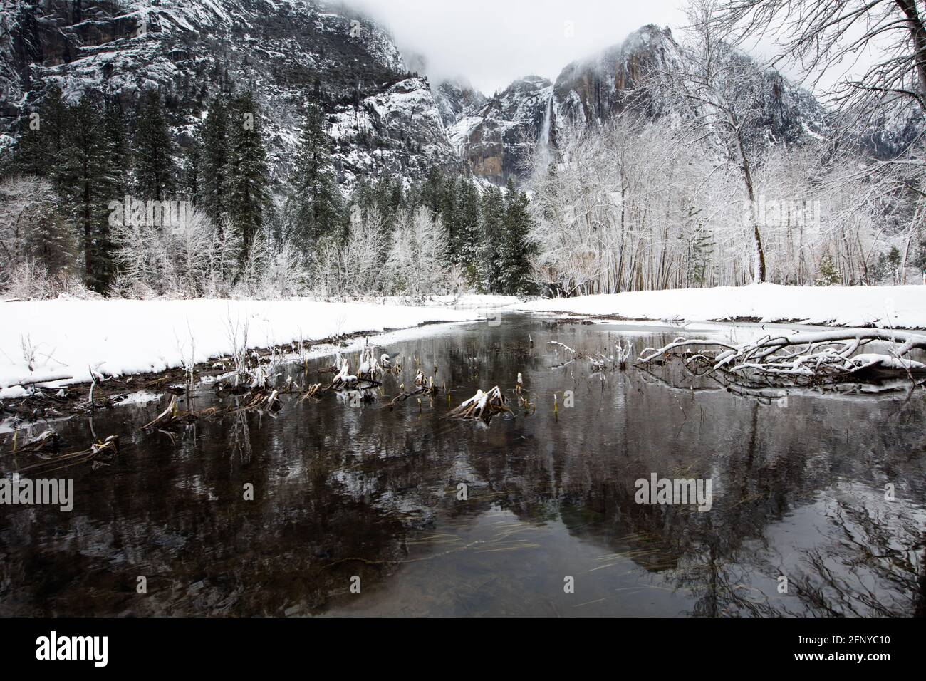Yosemite Valley in the winter with the Merced River and Upper Yosemite Falls in the background Stock Photo