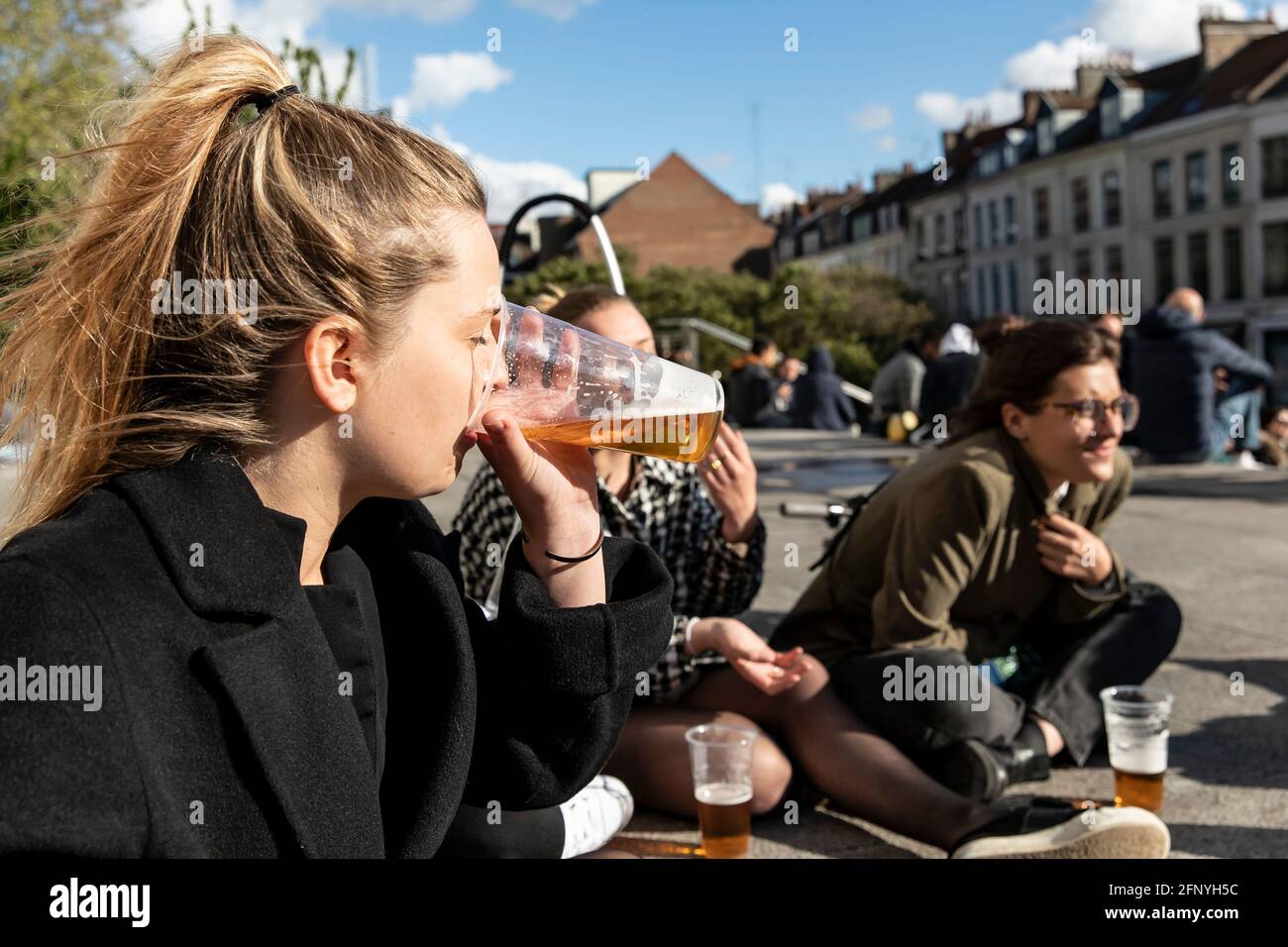 Lille, France. 19th May, 2021. People drink and chat in Lille, northern France, May 19, 2021. France on Wednesday took an important step forward towards returning to normality as people in the country can once again meet up in cafes or enjoy a meal in restaurants, which are now allowed to open their terraces. Credit: Sebastien Courdji/Xinhua/Alamy Live News Stock Photo