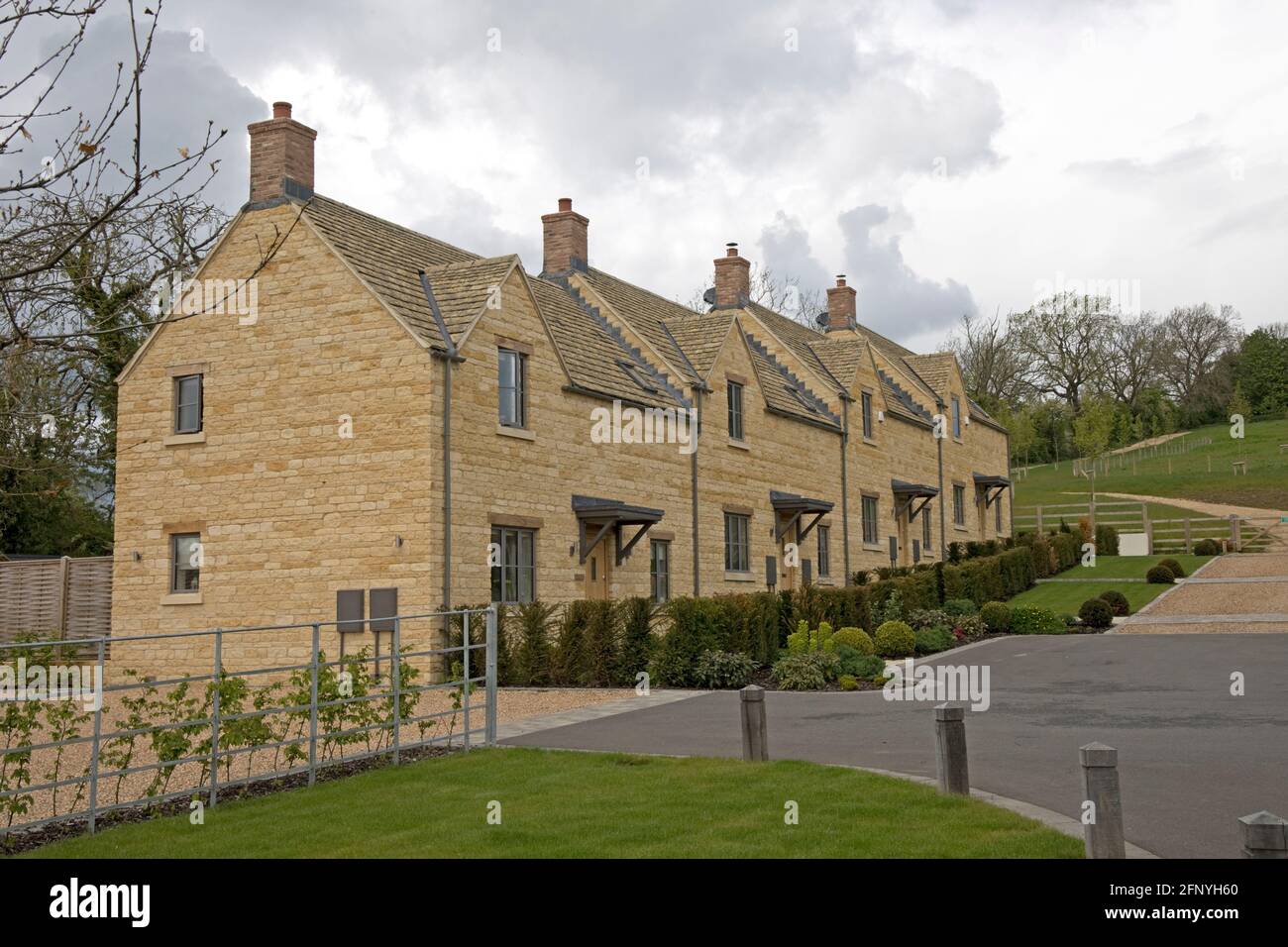 Attractive linked modern Cotswood stone houses Chipping Campden UK Stock Photo