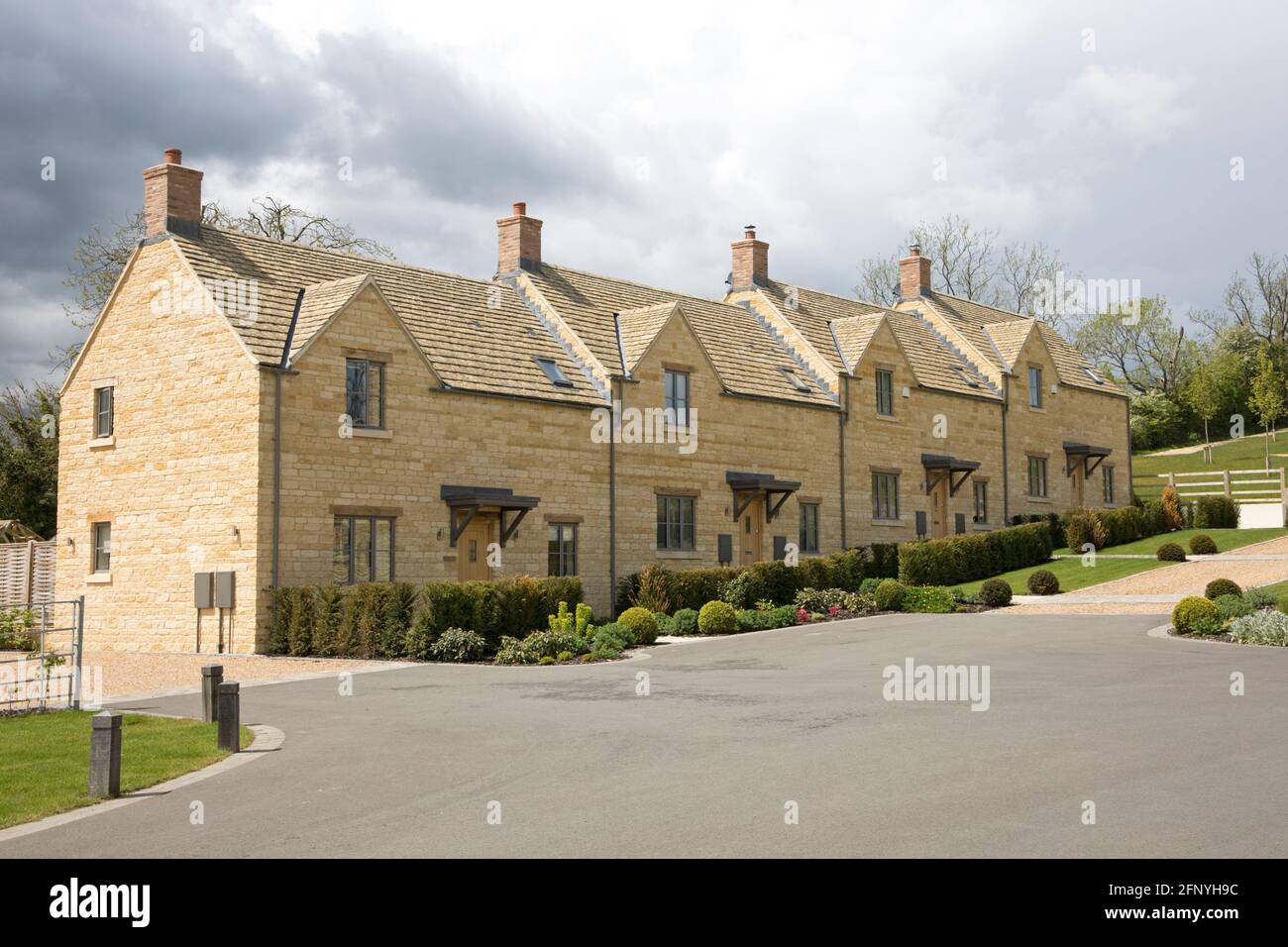 Attractive linked modern Cotswood stone houses Chipping Campden UK Stock Photo