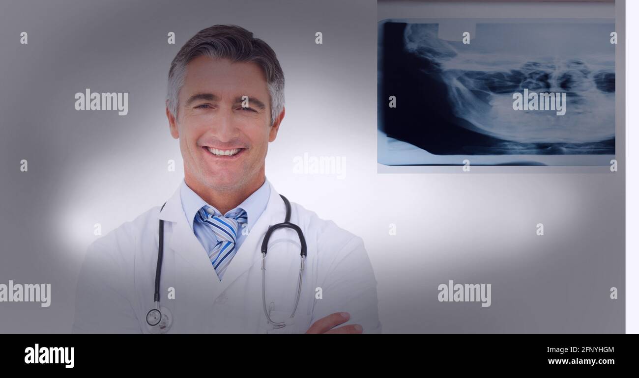 Health doctor smiling and looking at the camera wearing white blouse Stock Photo