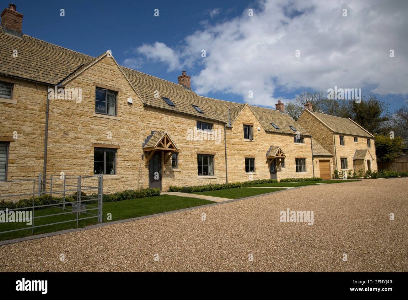 Attractive linked traditional new Cotswood stone houses in rural setting Chipping Campden UK Stock Photo