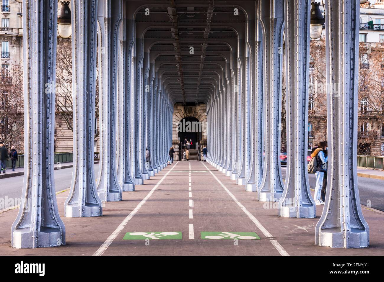 Paris, France - May 10, 2021: Panorama view of old historic Pont de Passy Bir-Hakeim steel arch bridge viaduct symmetry tunnel over Seine river in Par Stock Photo