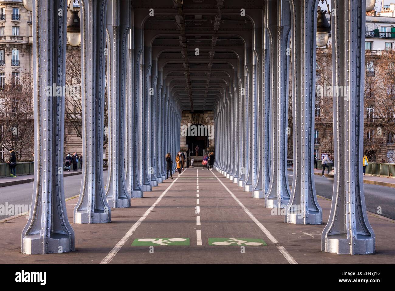 Paris, France - May 10, 2021: Panorama view of old historic Pont de Passy Bir-Hakeim steel arch bridge viaduct symmetry tunnel over Seine river in Par Stock Photo