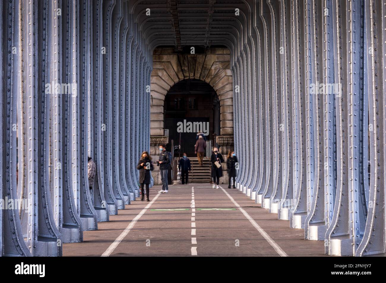 Paris, France - May 10, 2021: Panorama view of old historic Pont de Passy Bir-Hakeim steel arch bridge viaduct symmetry tunnel over Seine river in Par Stock Photo