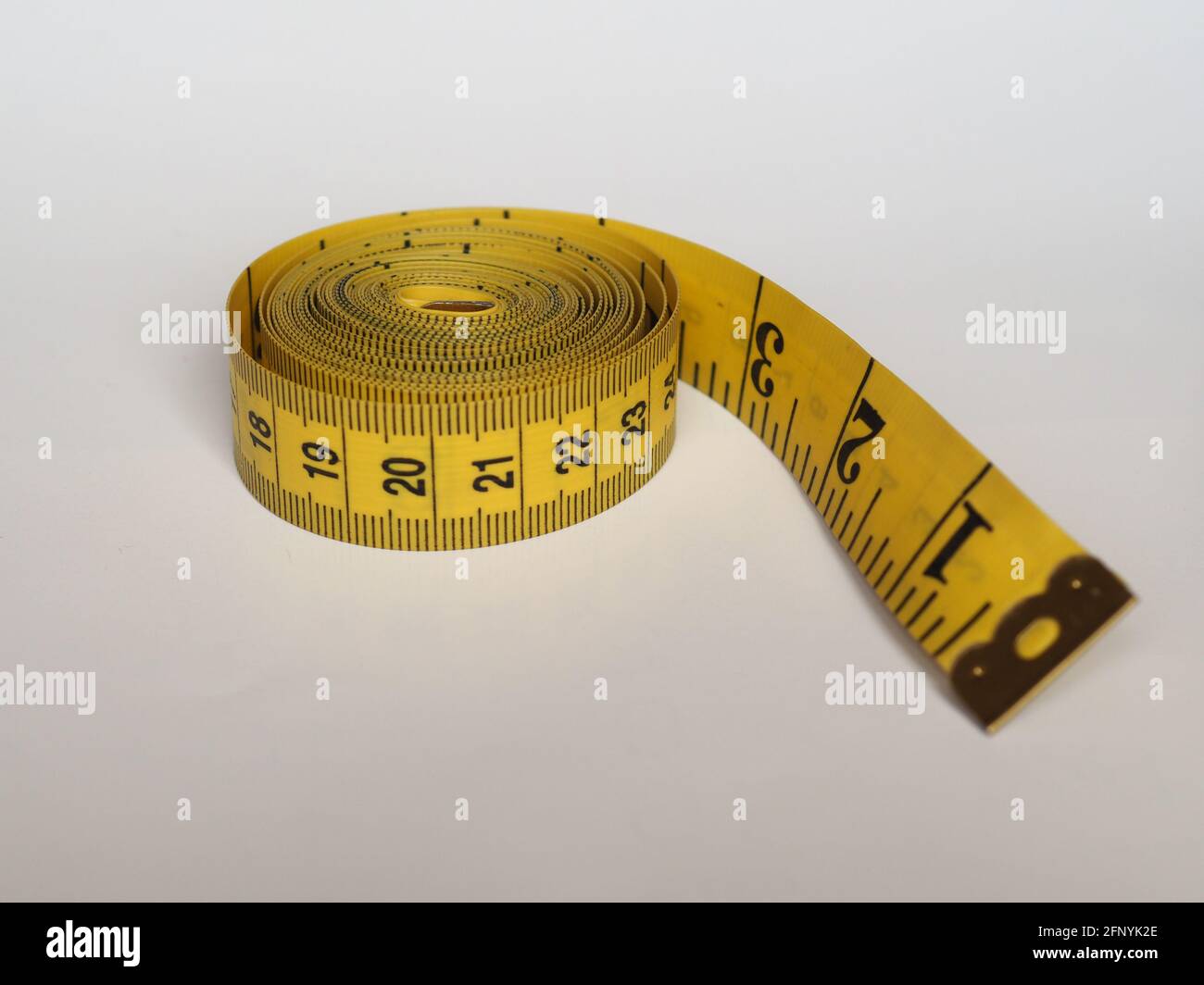 https://c8.alamy.com/comp/2FNYK2E/measuring-tape-flexible-ruler-ribbon-for-tailoring-with-both-imperial-and-metric-units-2FNYK2E.jpg