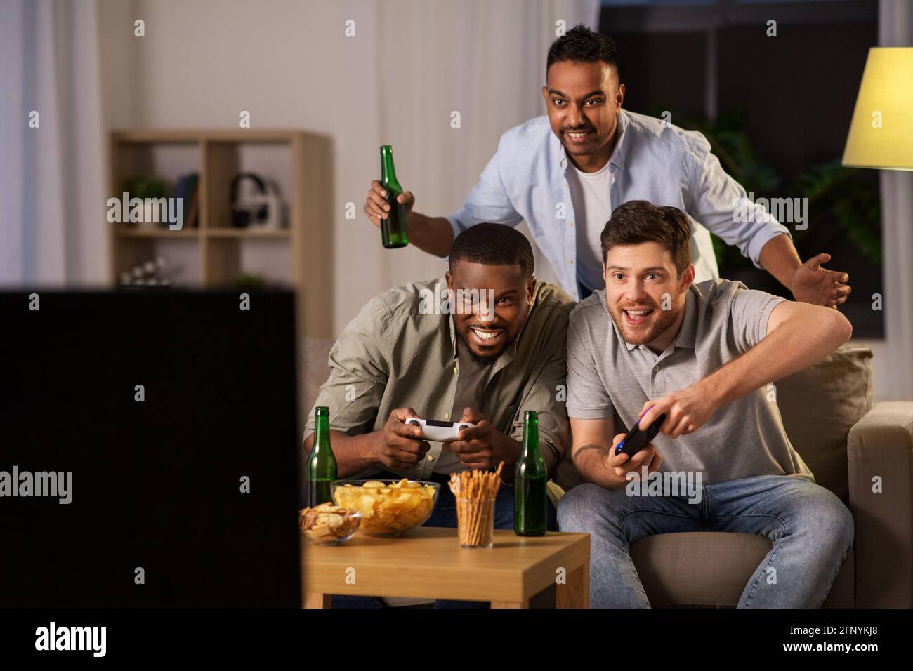 Premium Photo  Excited gamers friends playing video games at home