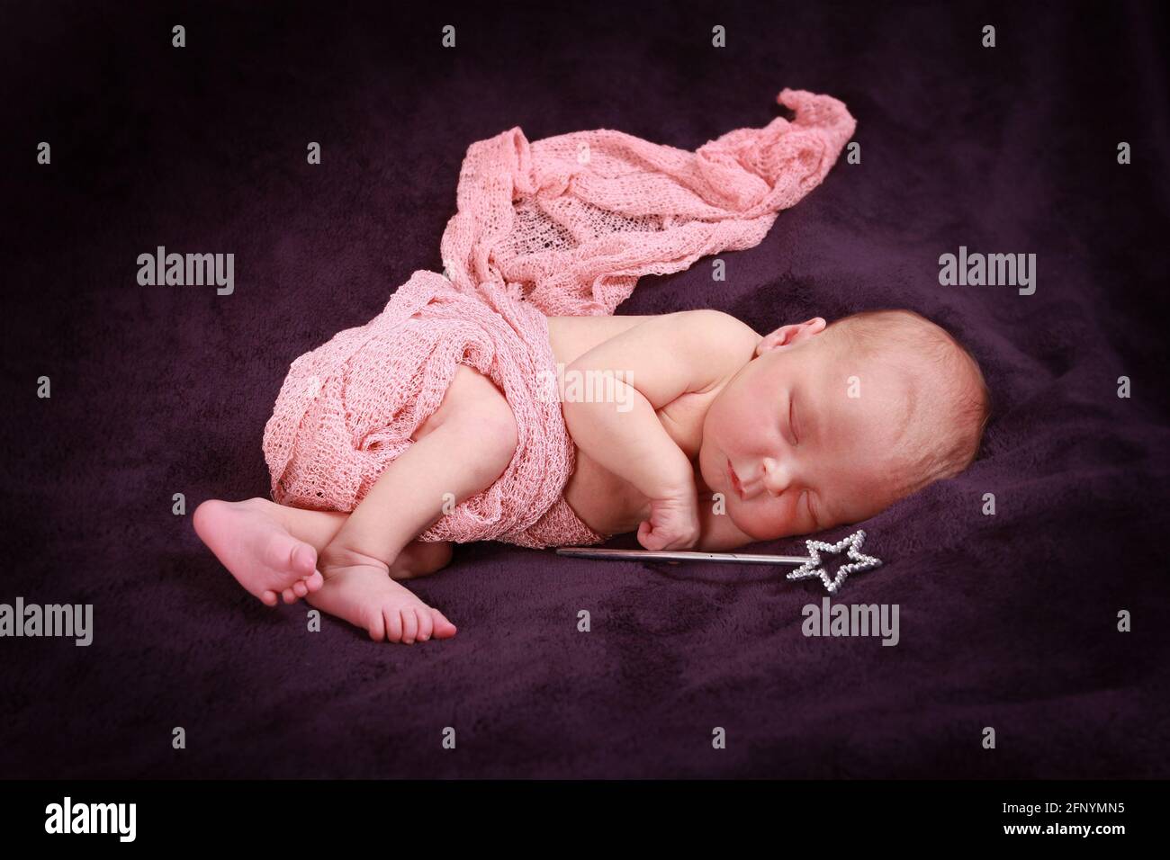 baby girl sleeping in a blanket, 10 day old baby girl Stock Photo