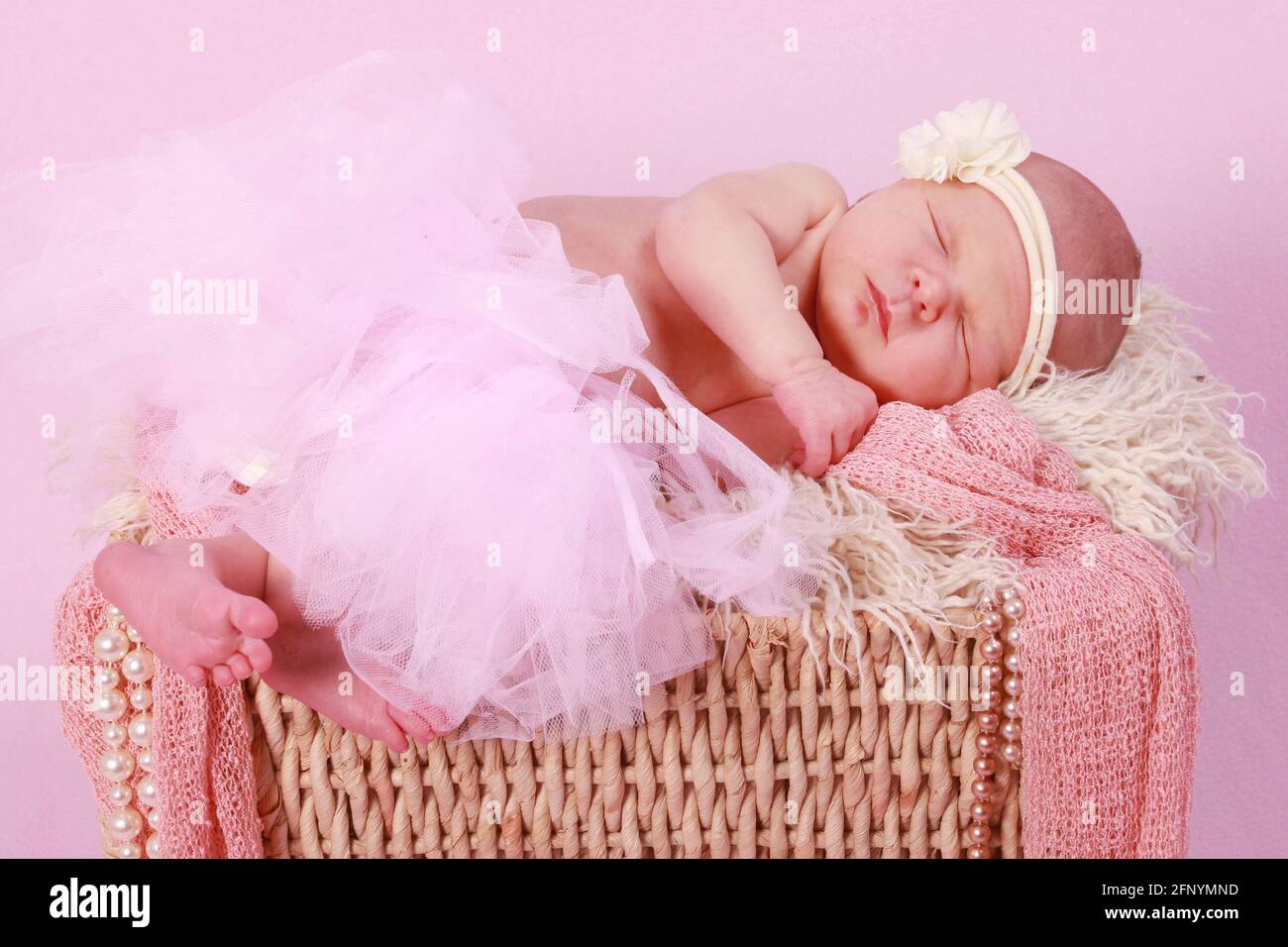 baby girl 10 days old asleep on baby scales, newborn baby Stock Photo