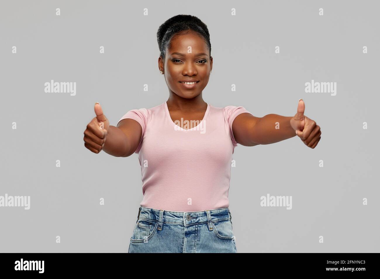 happy african american woman showing thumbs up Stock Photo - Alamy