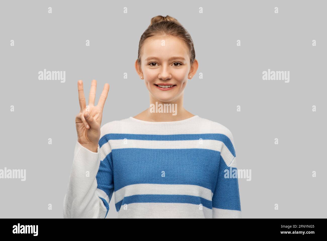 teen girl using 3 fingers