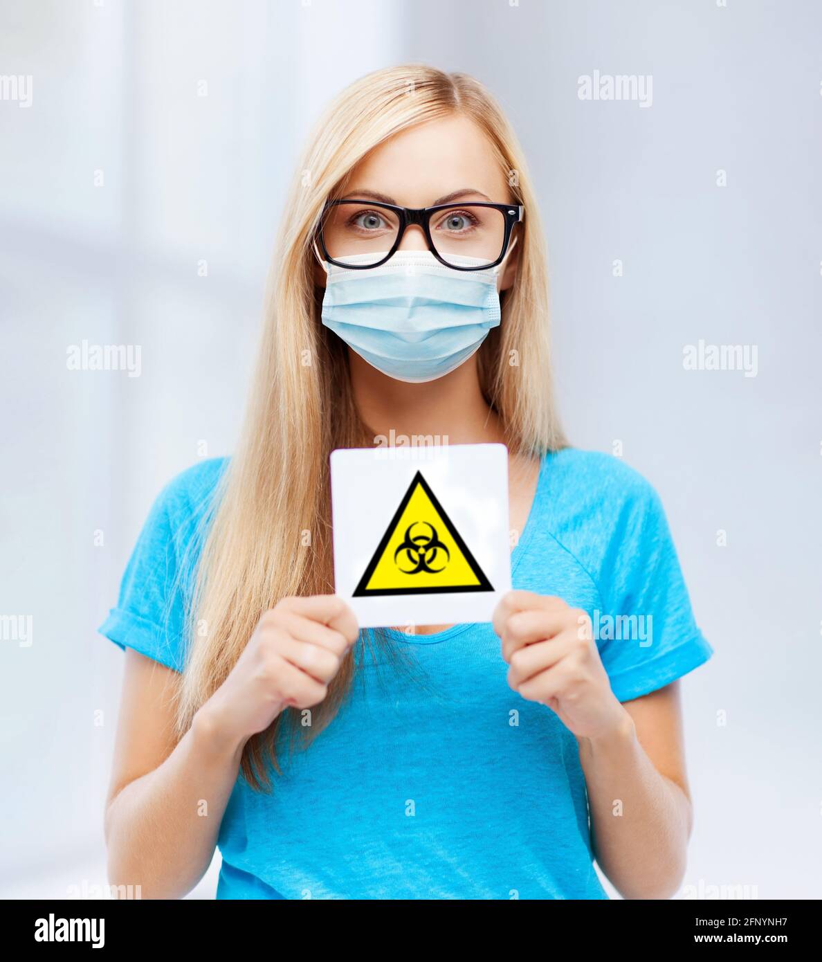 Woman in mask biohazard sign hi-res stock photography and images - Alamy