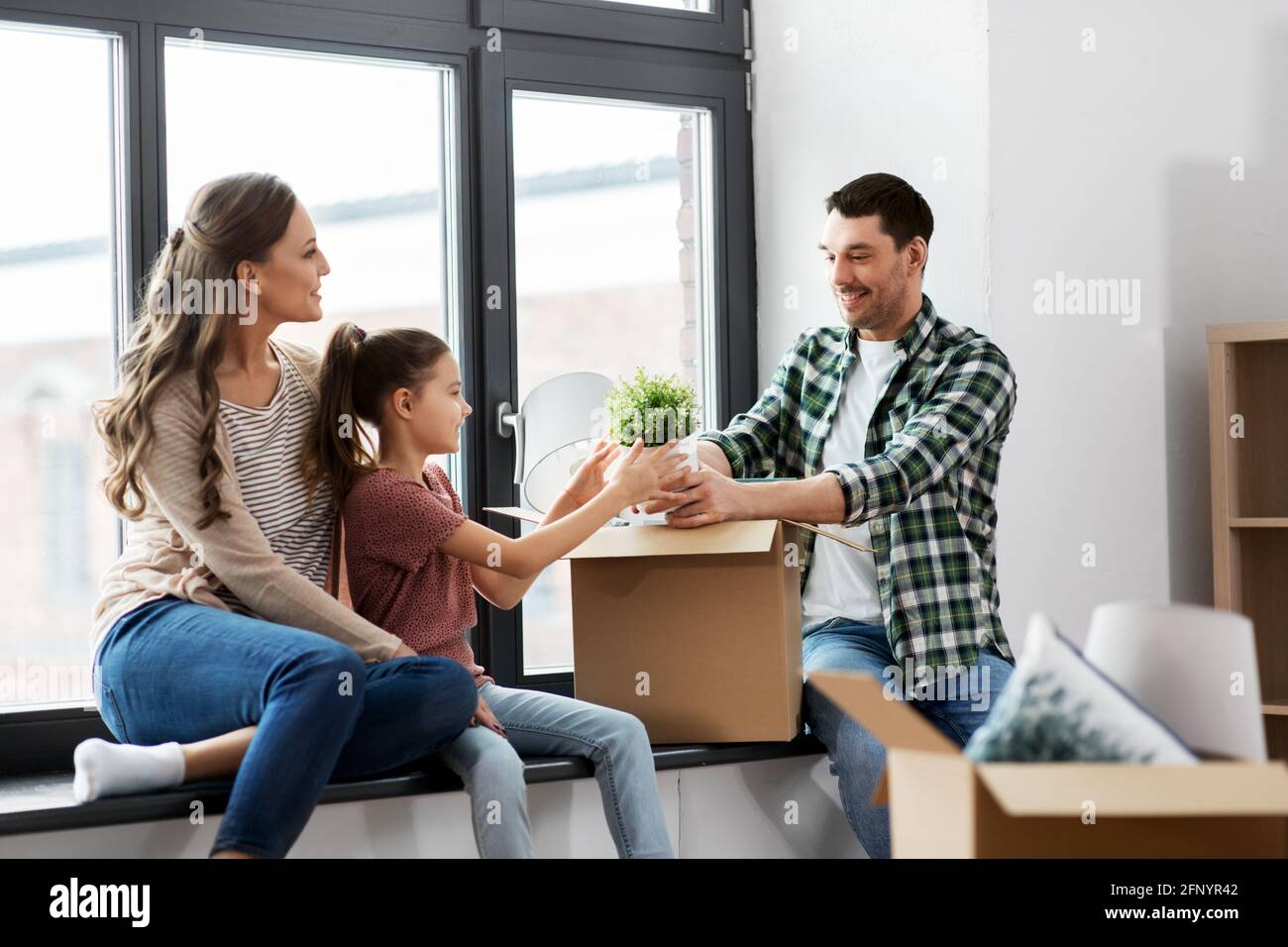 happy family with child moving to new home Stock Photo - Alamy