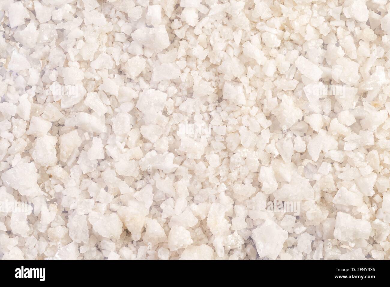 Top view pile of natural sea salt on the floor background. Stock Photo