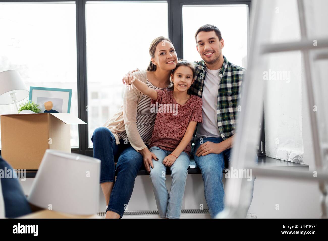 happy family with house keys moving to new home Stock Photo - Alamy