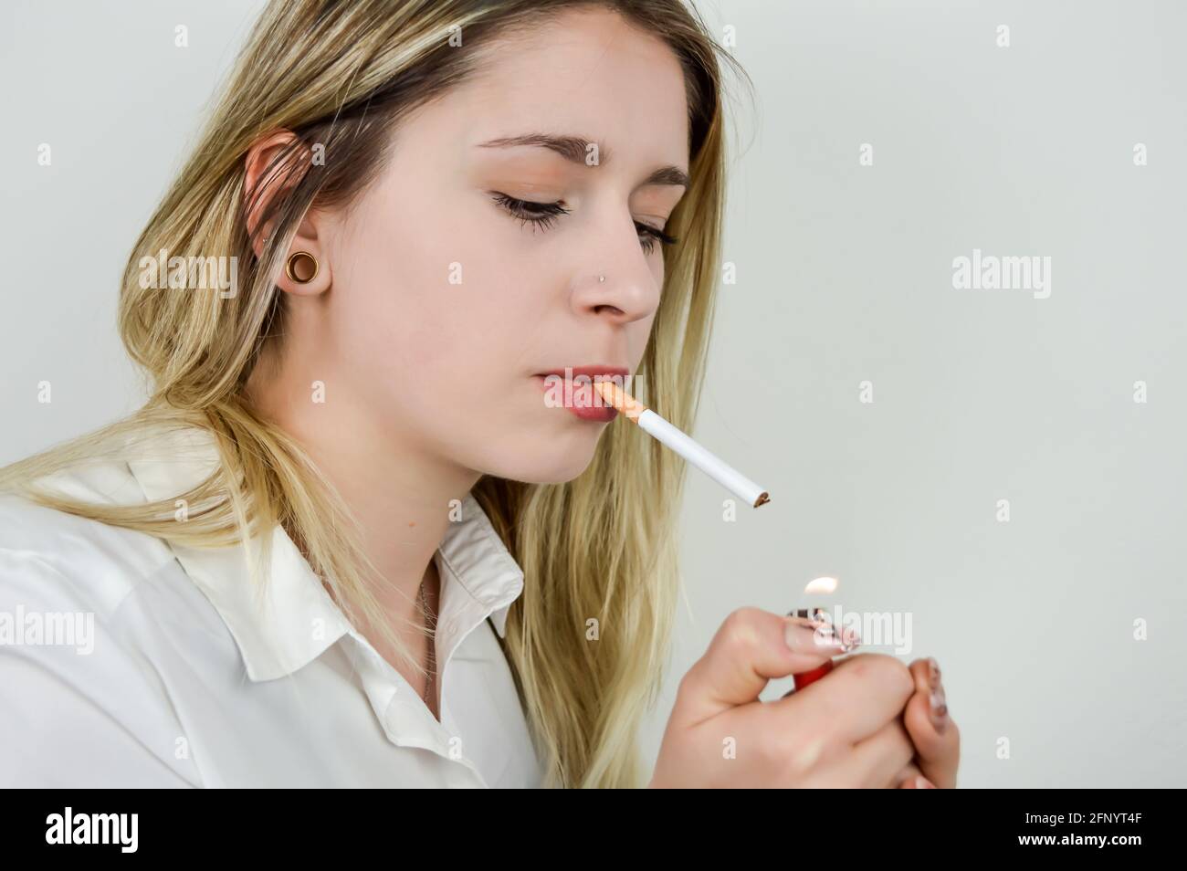 Hand holding lighter cigarette lighter hires stock photography and