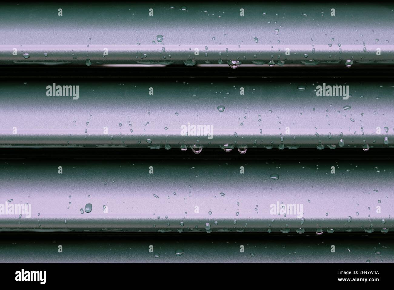 Raindrops and drip water on the shutter, detail Stock Photo
