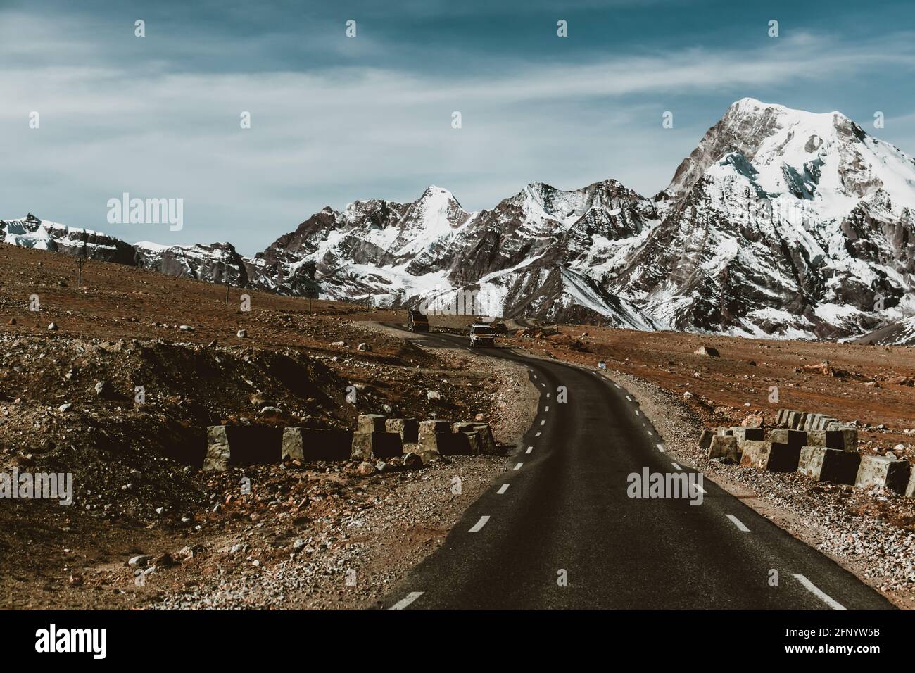 Narrow asphalt road in snowy hi-res stock photography and images - Alamy